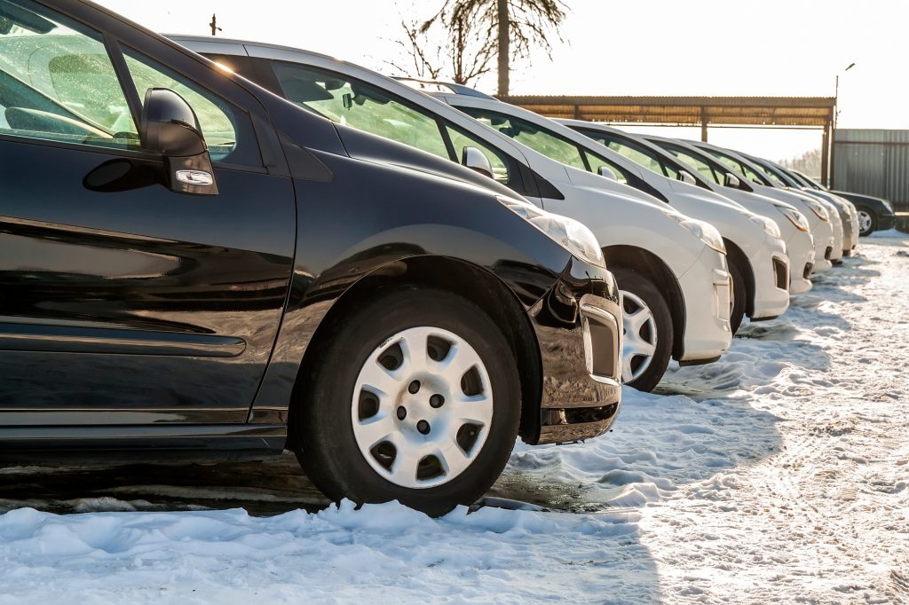 Parked Cars on a Lot. Row of New Cars on the Car Dealer Parking Lot. Cars for Sale Market Theme.